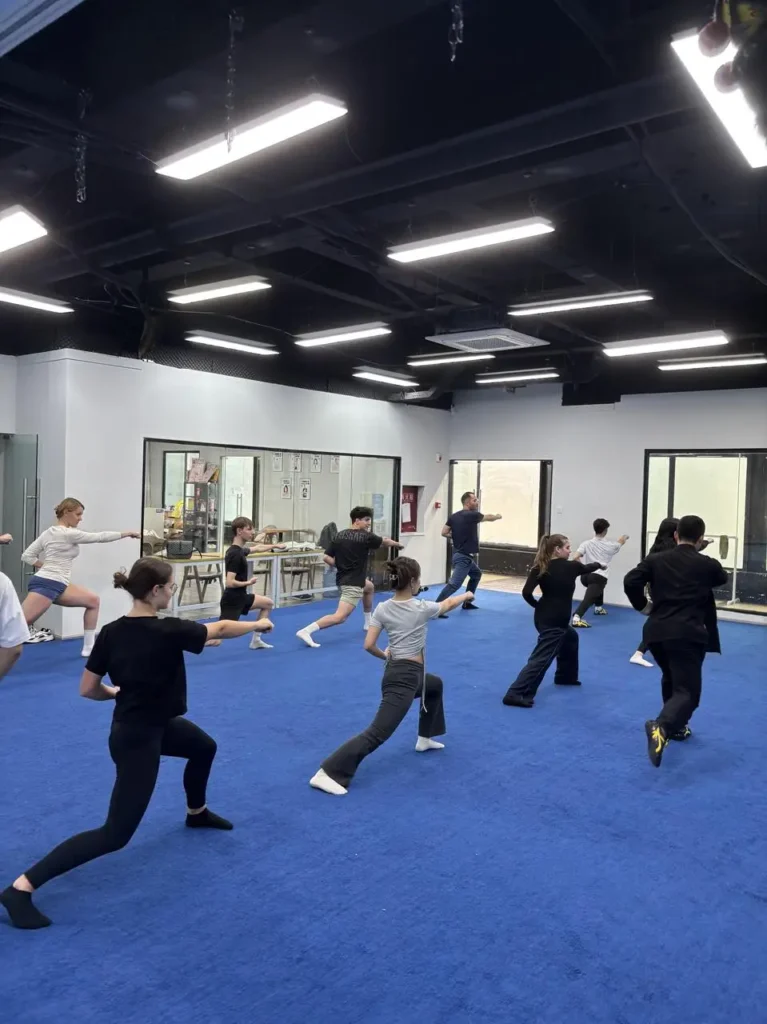 group of au pair student at a Kungfu event swords in China Chengdu with Masons Au Pair