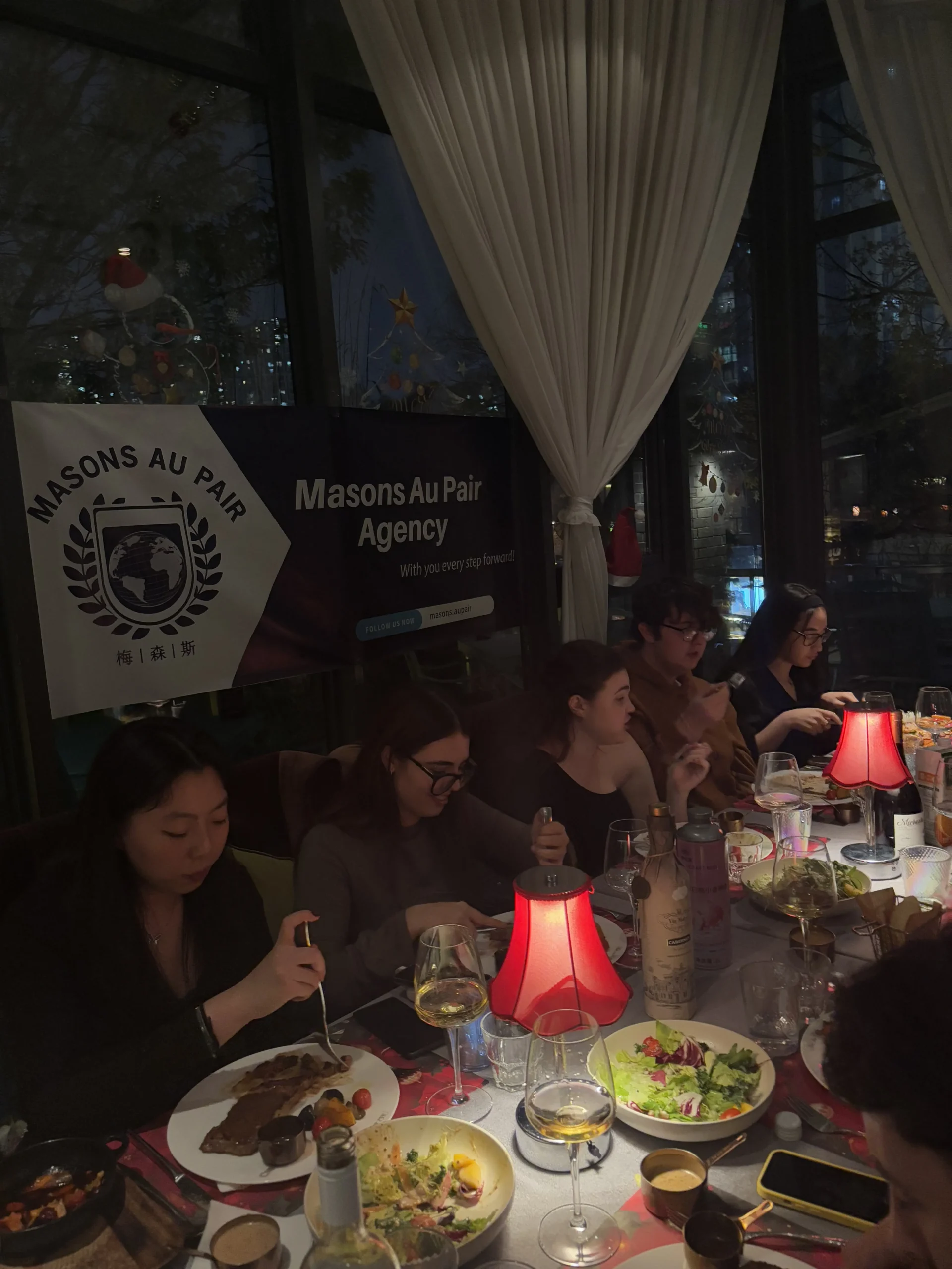 Full room of au pairs celebrating the solstice and the holidays