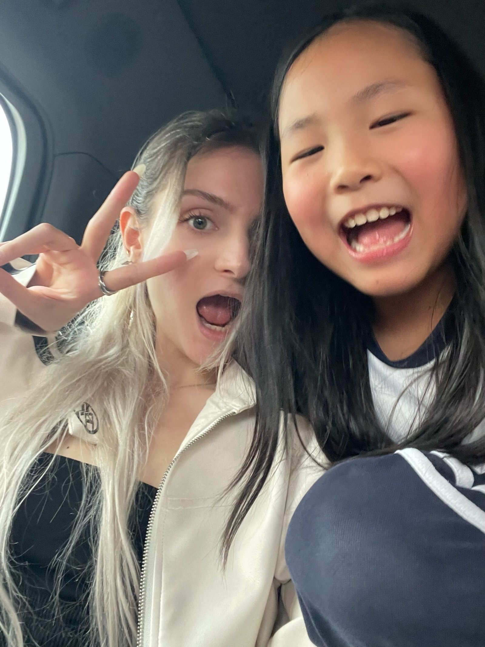 Alice, au pair in Chengdu, taking a selfie with a child