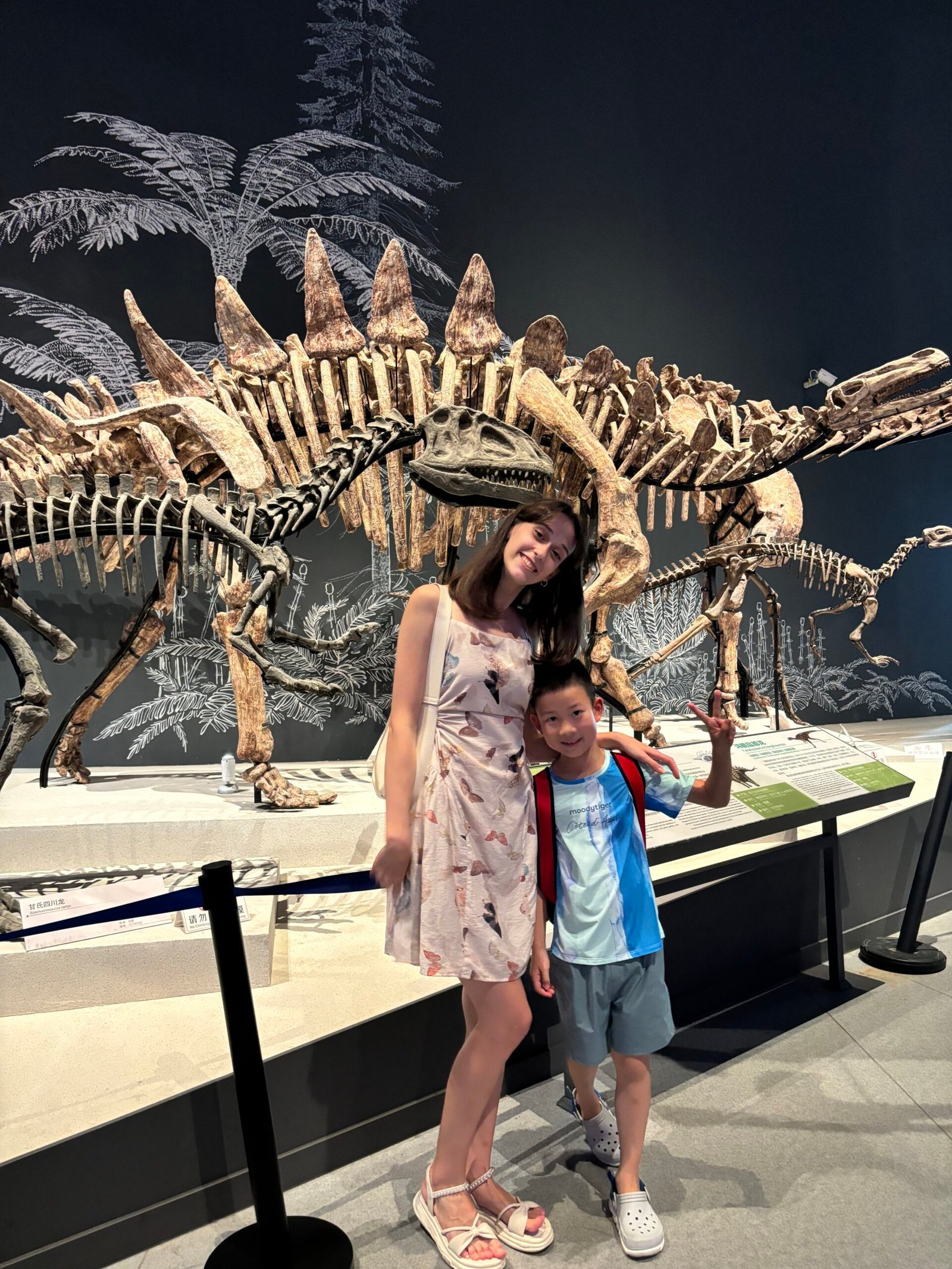Nadya with Bobby at a dinosaur museum